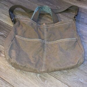 Canvas tote with shoulder strap and carrying handles.